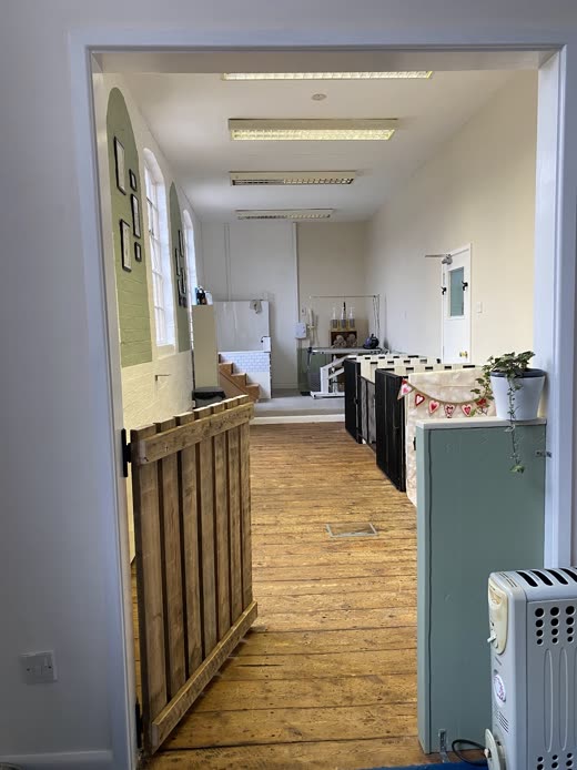 The bright grooming room with its wooden floor and reception counter